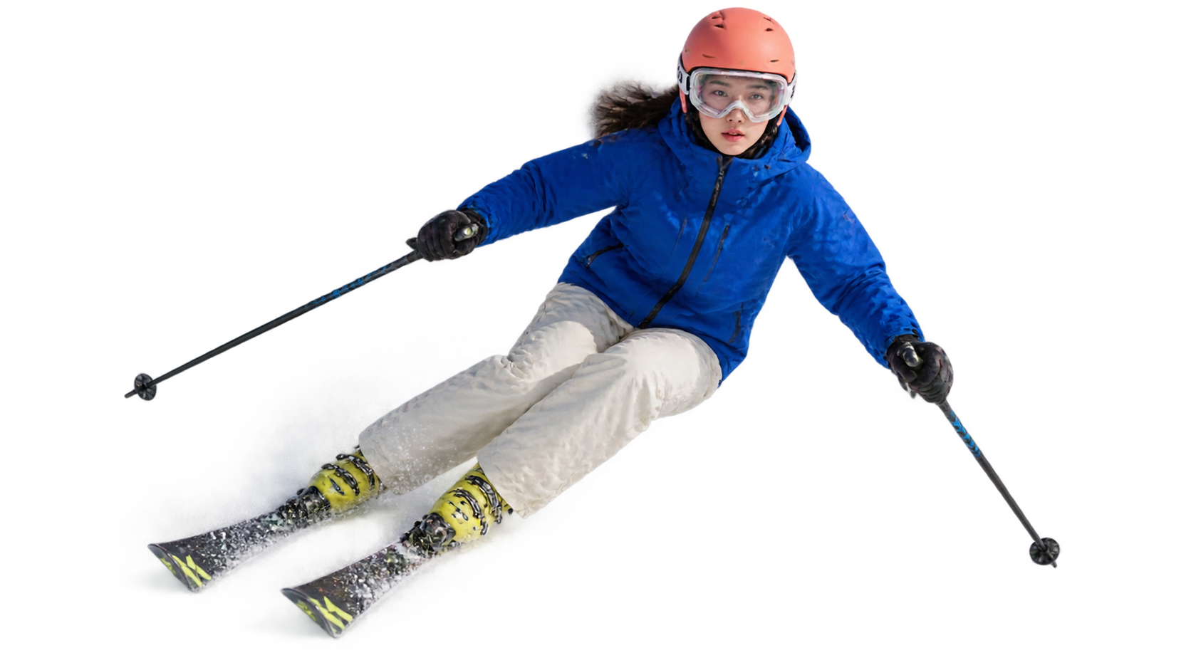 A young skier leaning into a turn.